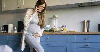 Pregant woman with cramps making call